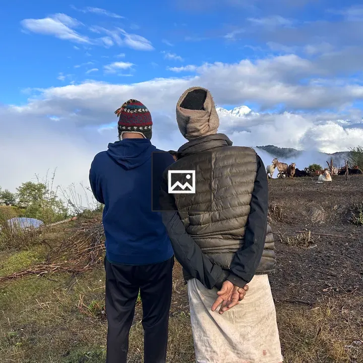 Two people under a wide sky