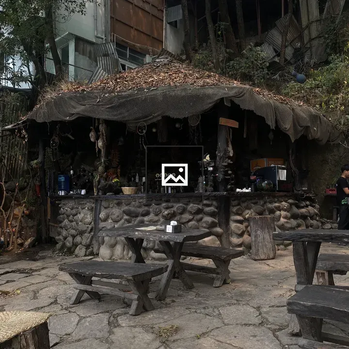 Rustic outdoor bar with stone facade