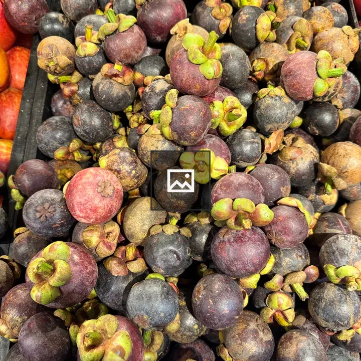 Mangosteens in Black Tray