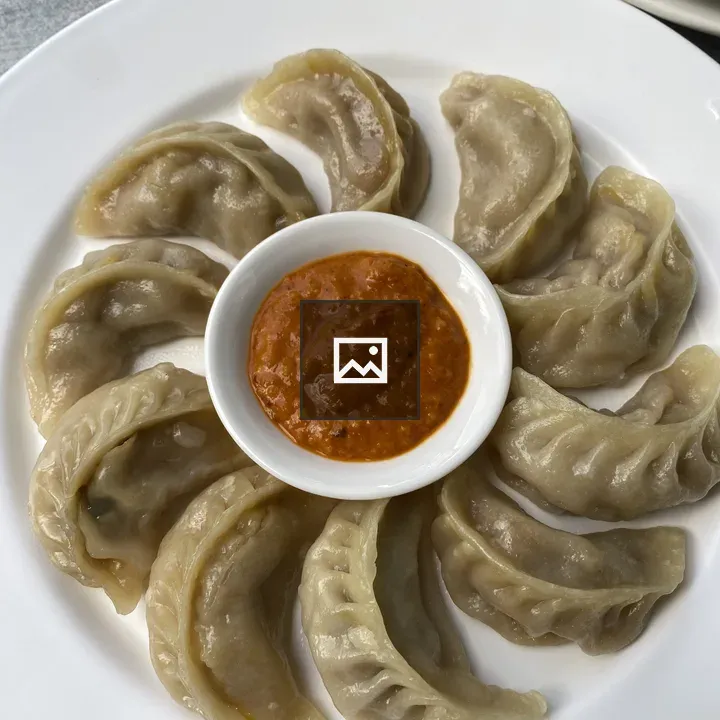 Momos on a Plate with Dipping Sauce