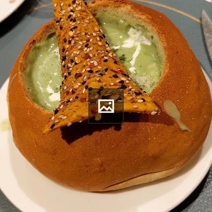 Creamy soup in bread bowl