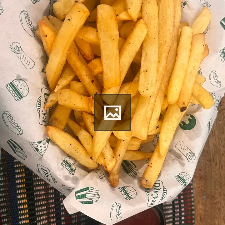 Golden French Fries in Paper Basket