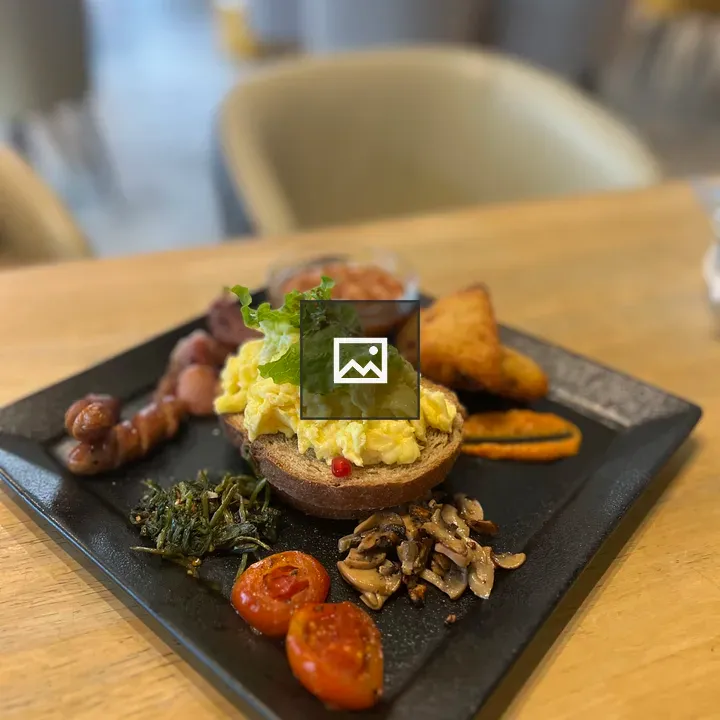 Breakfast plate with eggs and sausages