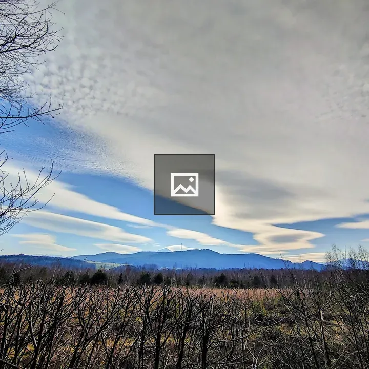 Clouds Over Tree and Mountain