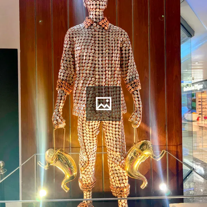 Life-sized sculpture with pocket watch faces