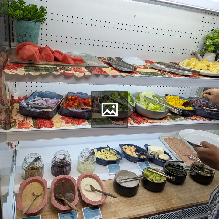 Salad bar buffet with fruits and greens