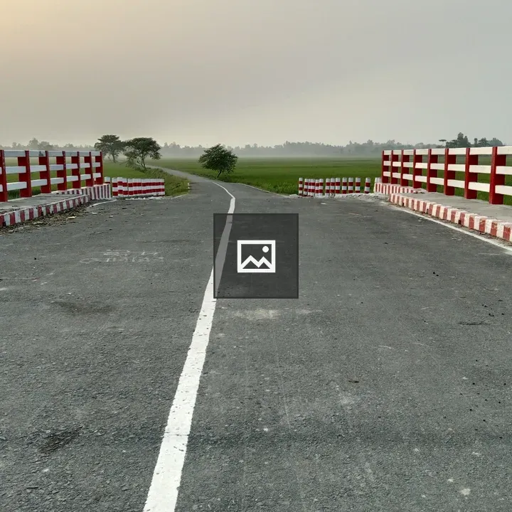 Narrow road over small bridge