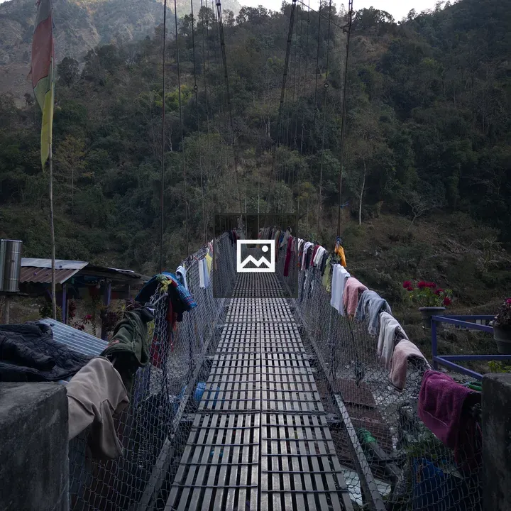 Suspension Bridge over Mountain Landscape