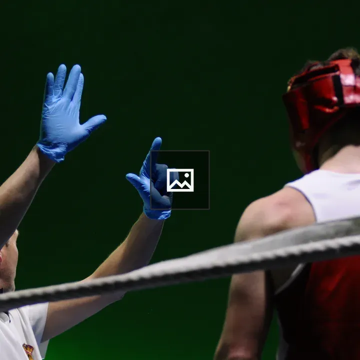 Boxing referee during training bout