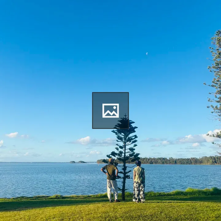 Two people overlooking the sea