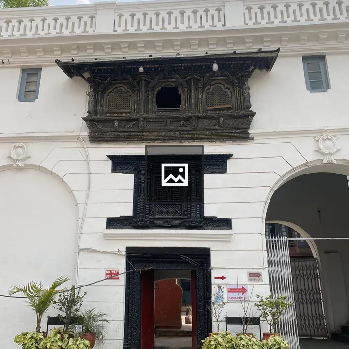 Facade with Black Woodwork Above Door