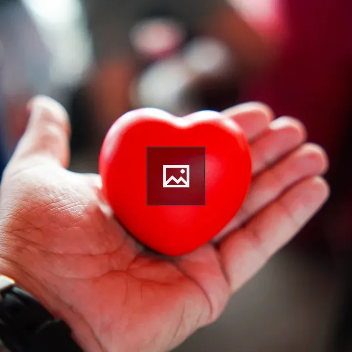 Hand Holding Red Heart Stress Ball