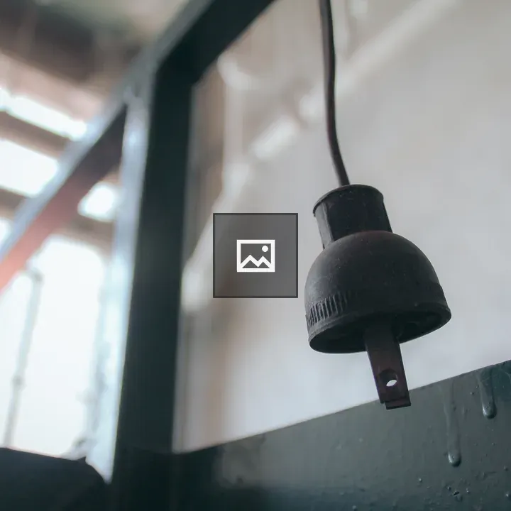 Old power cord hanging from ceiling