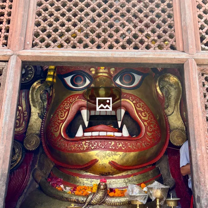 Giant gold deity face
