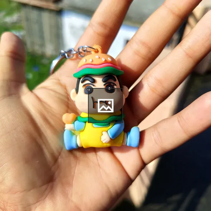 Handheld keychain character in burger costume