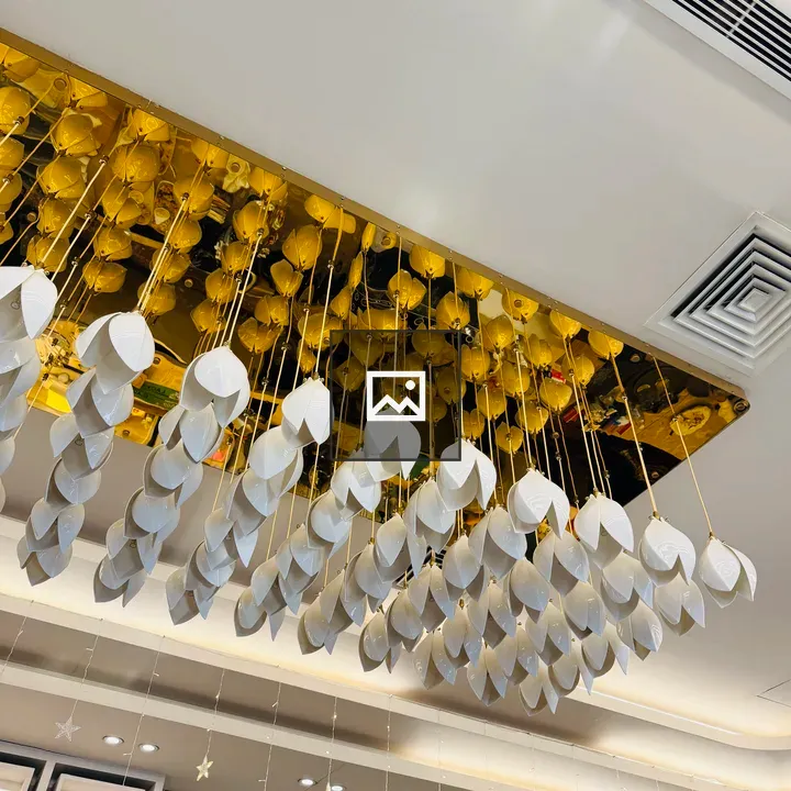 Hanging art installation with white geometric shapes