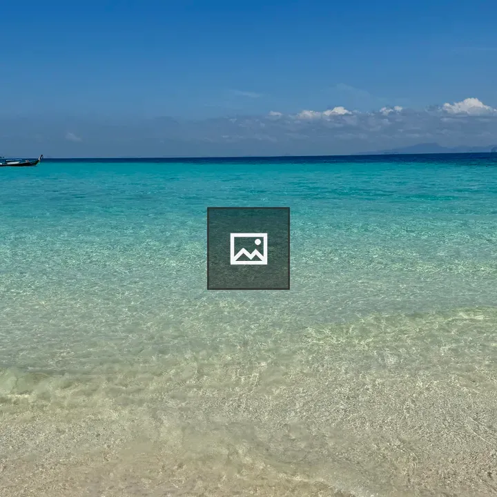 Beach scene with boat and catamaran