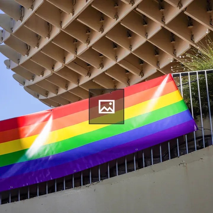 Rainbow flag over railing