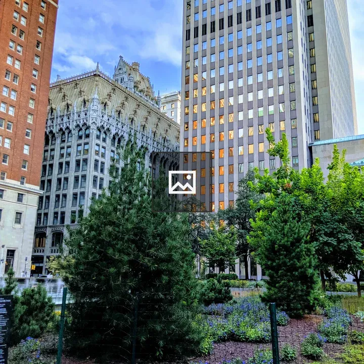 Three tall buildings and park in Downtown Pittsburgh