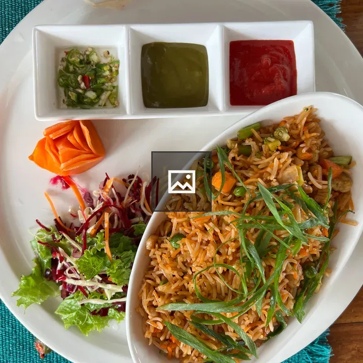 Plate of fried rice with side salad