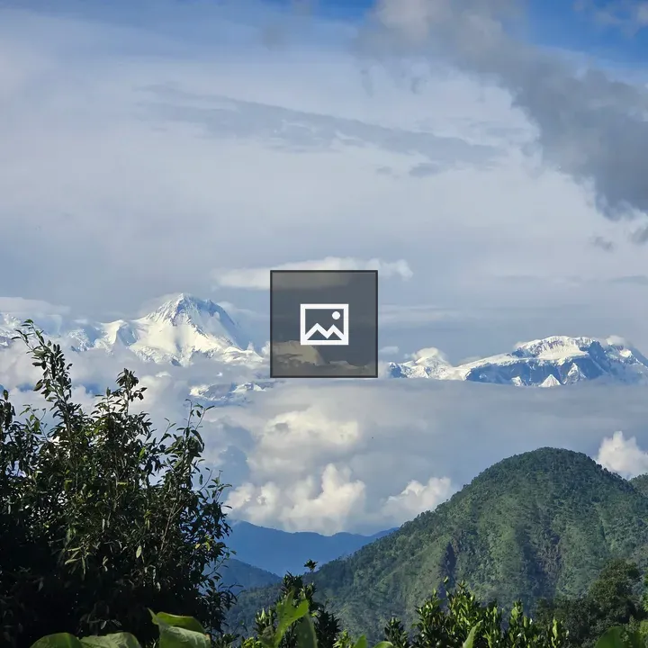 Snow-capped Mountains with Green Foreground