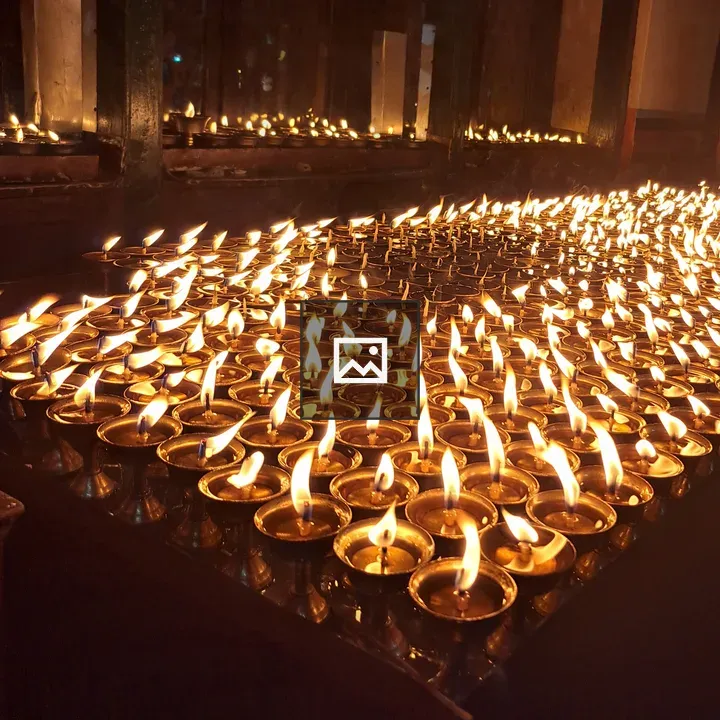 Butter lamps in prayer