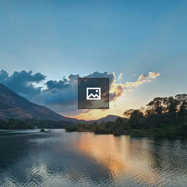 Golden sunset over calm lake