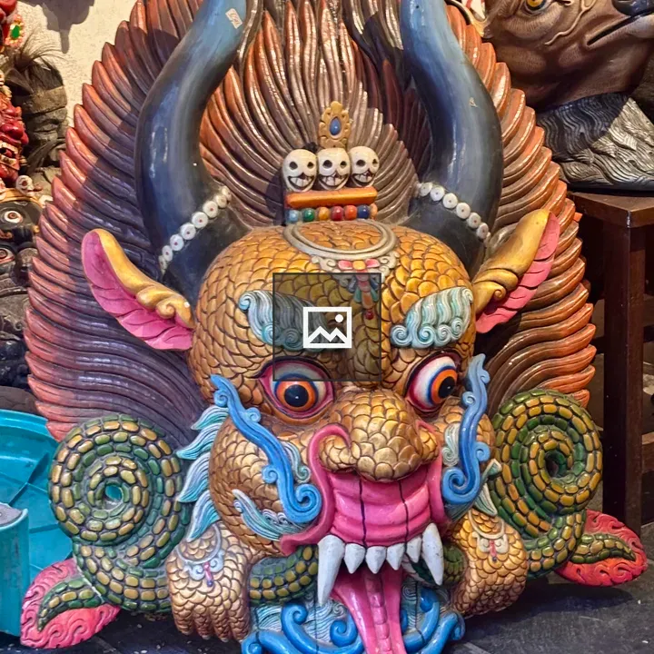 Carved dragon mask portrait