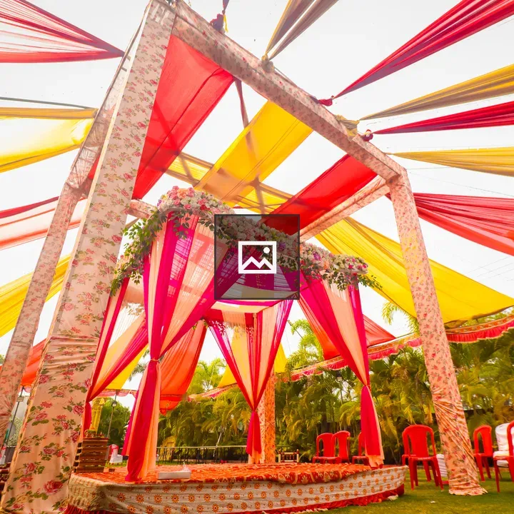 Wedding mandap with yellow and red