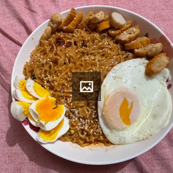 Bowl of noodles with egg and chicken