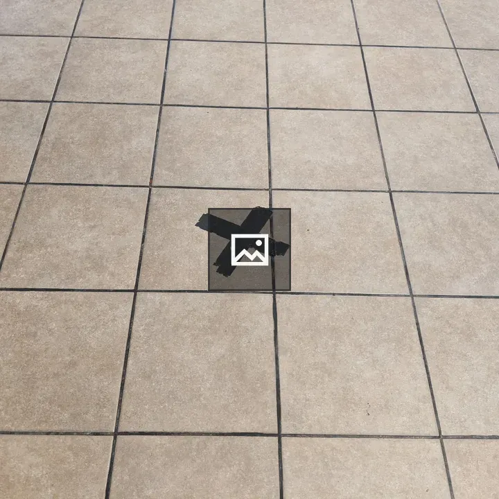 Black Tape X on Floor