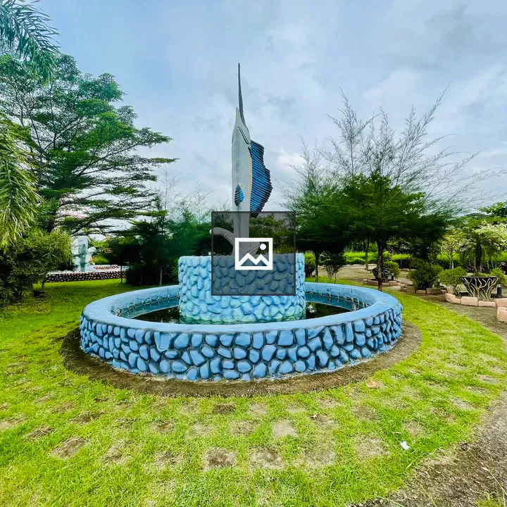Decorative fountain with jumping fish statue