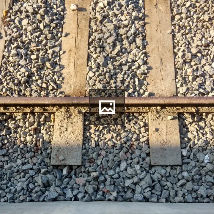 Pair of black shoes at platform edge
