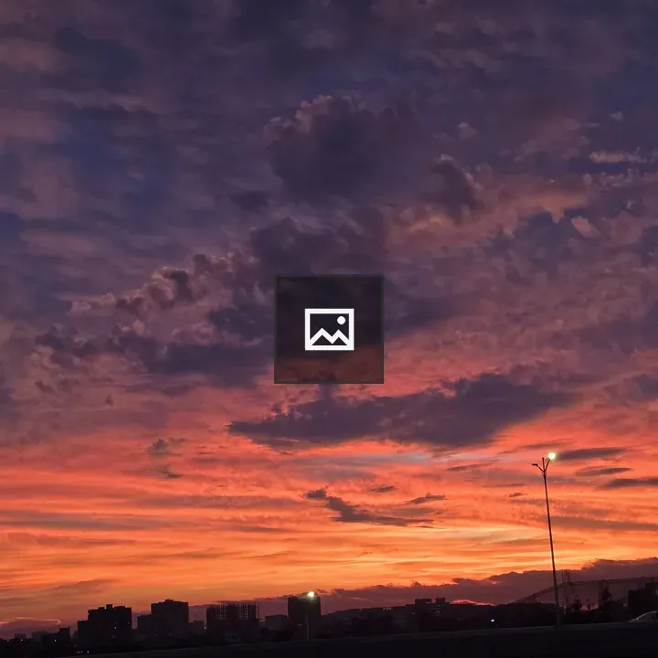 Sunset Sky Over Dark Clouds