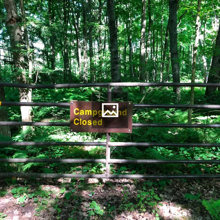Metal gate at campground edge