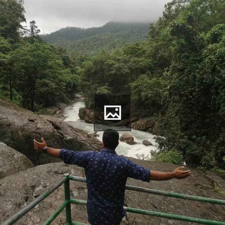 Man by Waterfall
