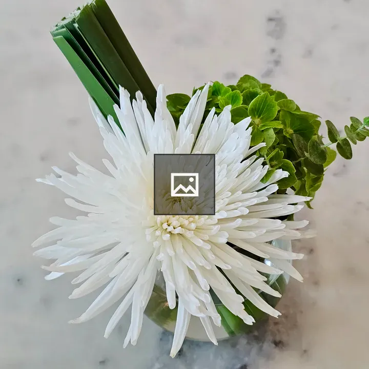 White flower arrangement in glass vase