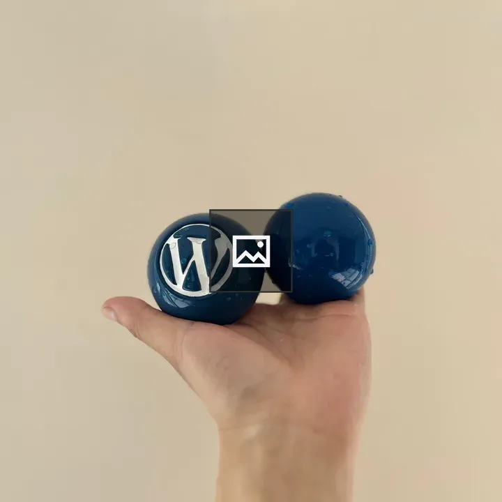 Two blue balls in palm