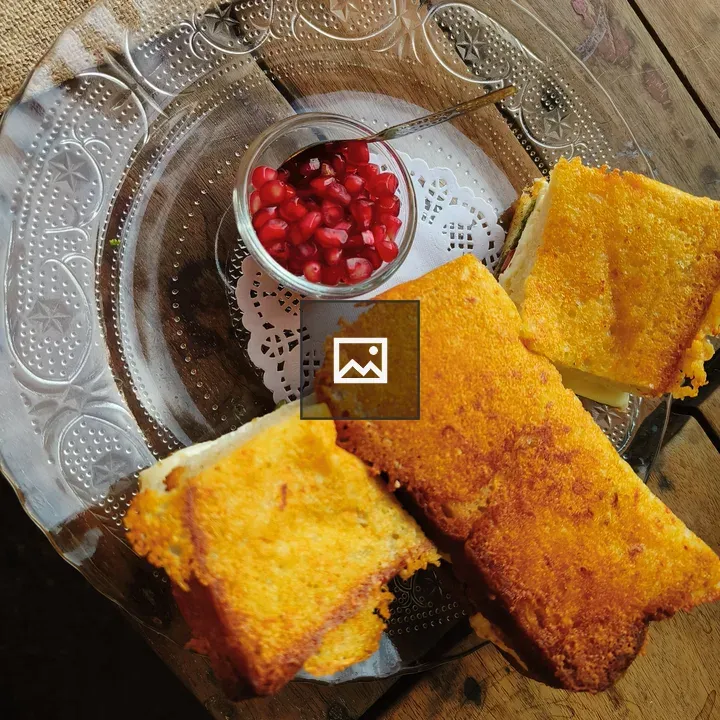 Three Golden Sandwiches on Plate