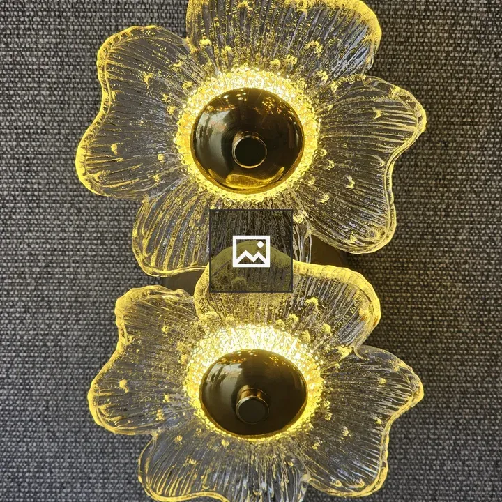 Two flower-shaped wall lamps