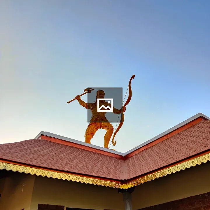 Golden Warrior Statue on Building