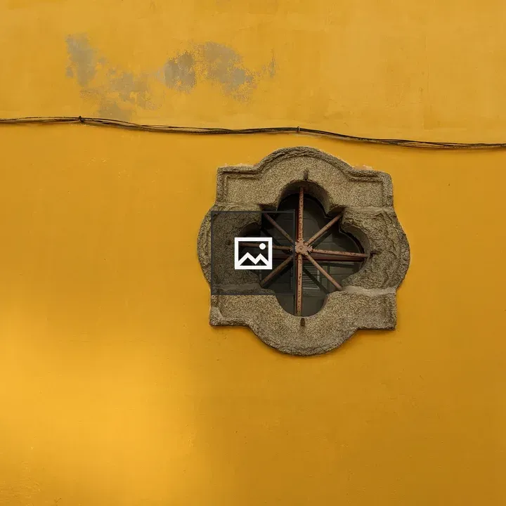 Yellow wall with porthole window