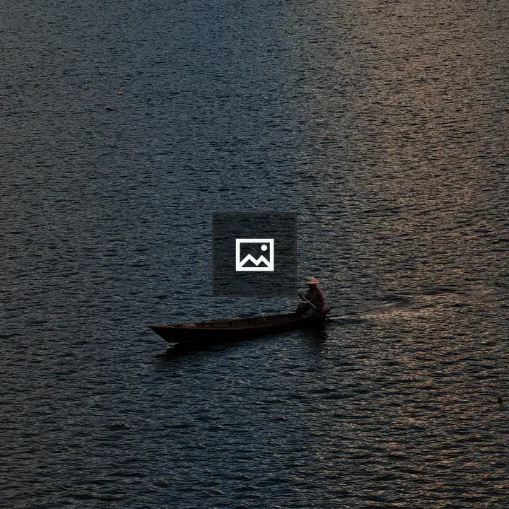 Boat on tranquil twilight waters