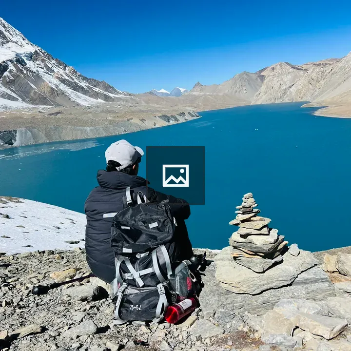 Person beside cairn at Tilicho Lake