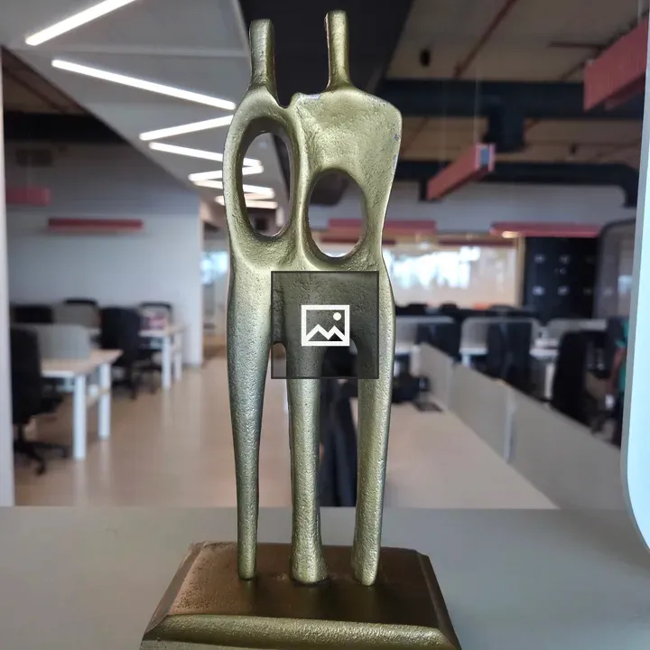 Golden abstract sculpture duo