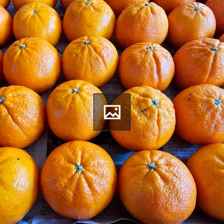Fresh oranges on newspaper