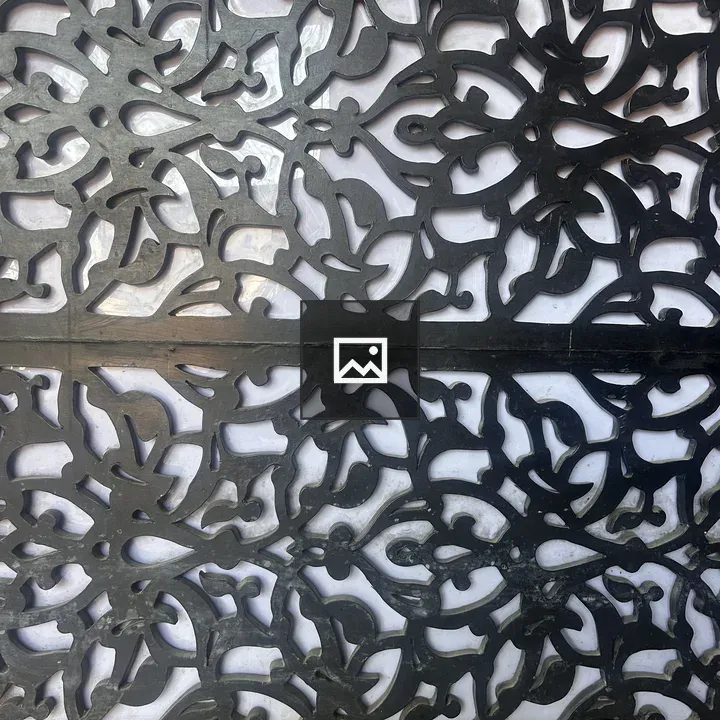 Dark carved wooden panel