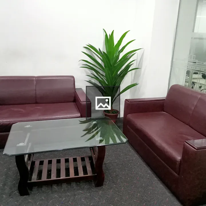 Cozy seating area with maroon sofas