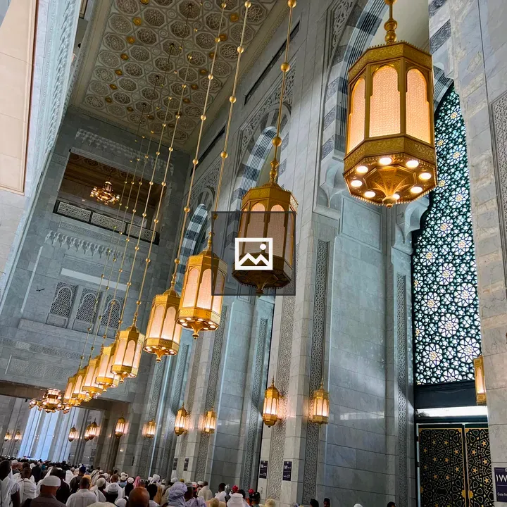 Ceiling chandelier above worshipers