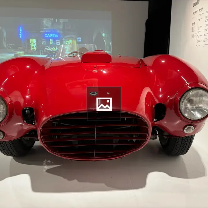 Sleek red race car front view
